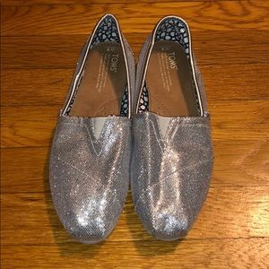 Toms silver slip-ons